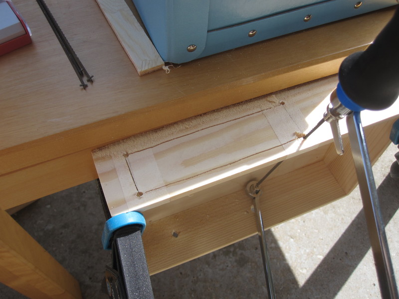 Sawing out a rectangular hole for the back panel